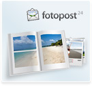 Geöffnetes Fotobuch mit Karibikfoto über zwei Seiten bedruckt